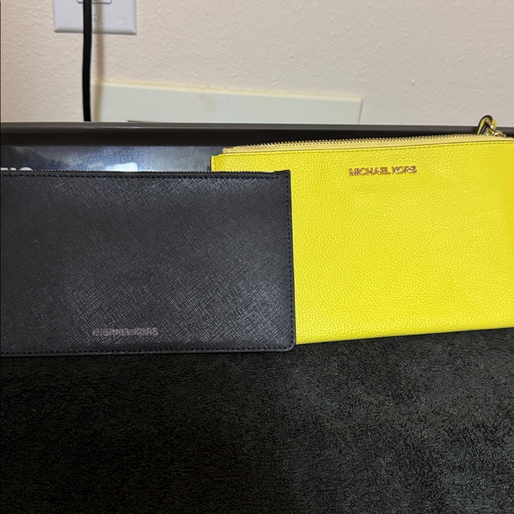 Two Michael Kors Wristlets bright yellow and black in new condition